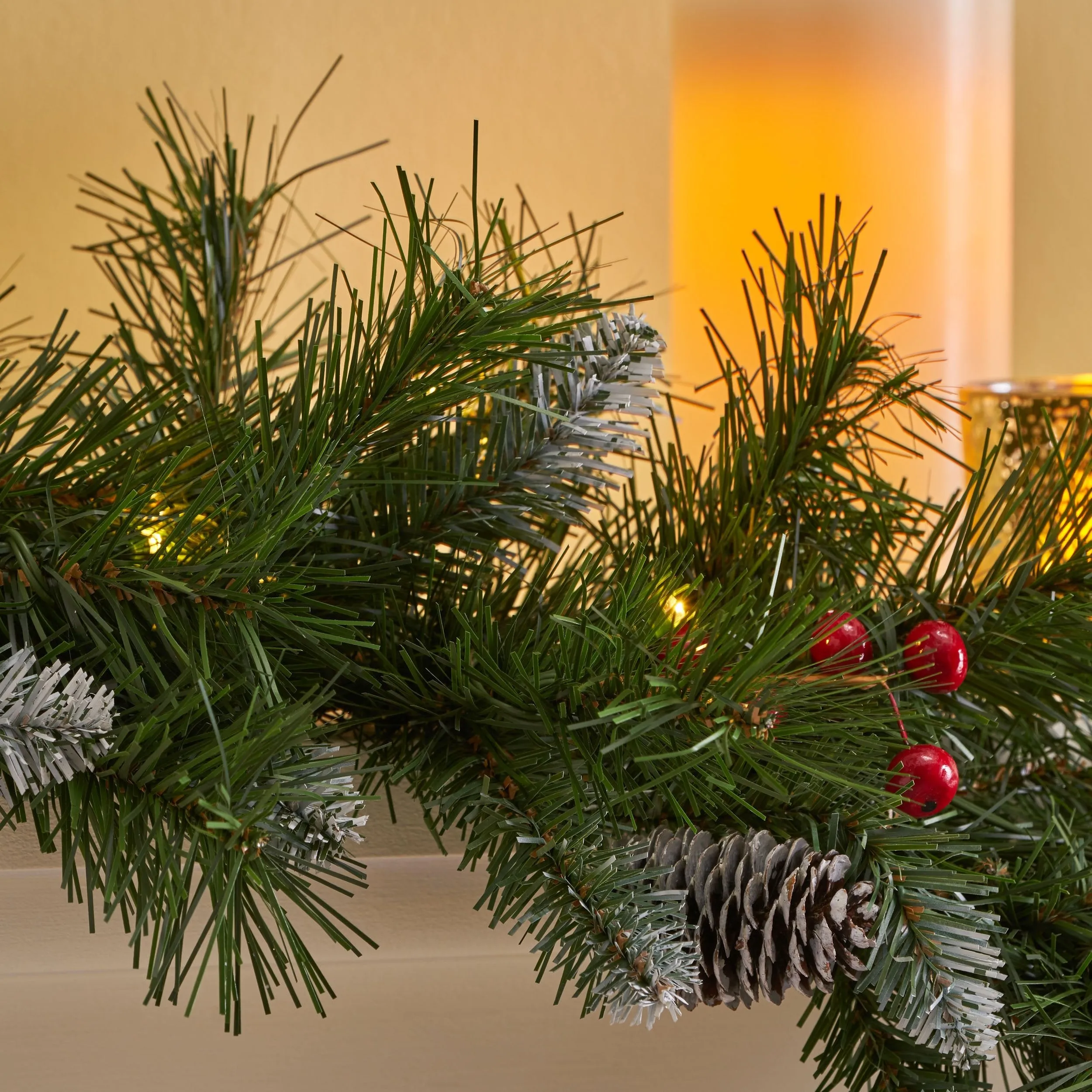 9-foot Mixed Spruce Pre-Lit Warm White LED Artificial Christmas Garland with Frosted Branches, Red Berries and Pinecones - NH293703